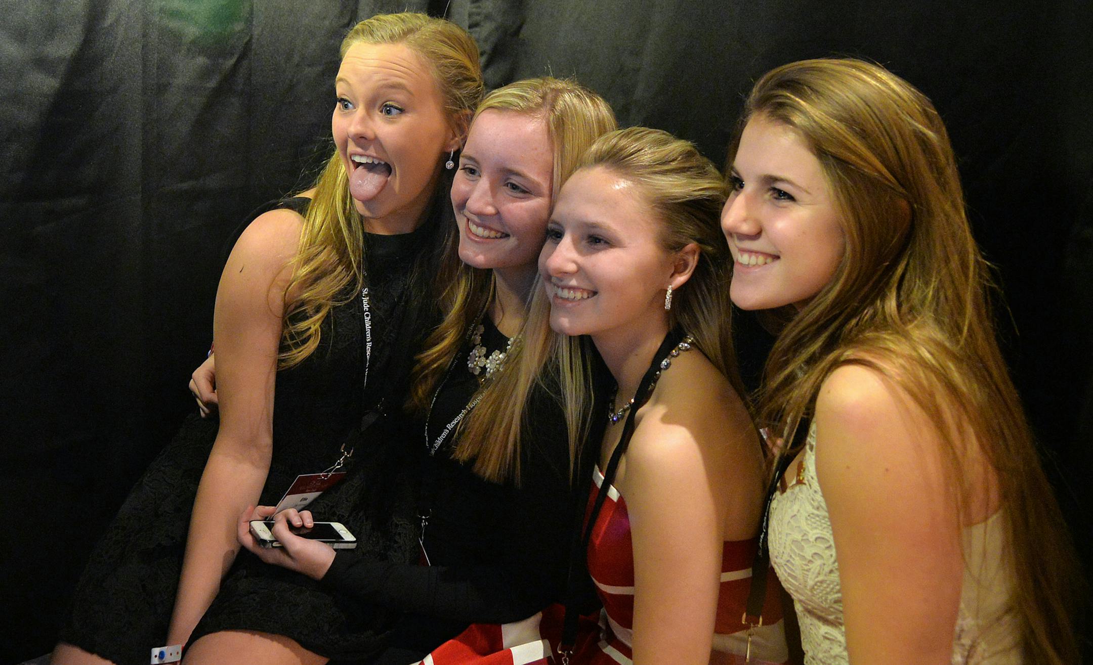 From left, Ellie Kimmes, Alex Ruschiano, Emily Geelan and Rachel Fay pose for photos inside the photo booth. ] (SPECIAL TO THE STAR TRIBUNE/BRE McGEE) **Ellie Kimmes (left), Alex Ruschiano (center left), Emily Geelan (center right), Rachel Fay (right)