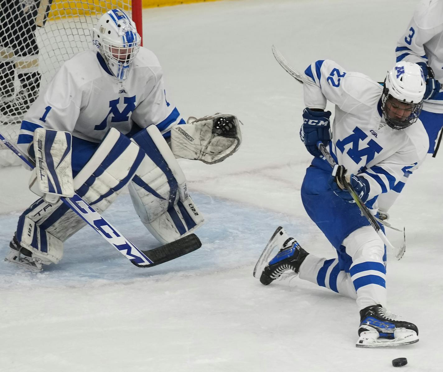 Minnetonka goalie Hunter Bauer (1) defends with the help of Javon Moore (22) at the Pagel Activity Center in Minnetonka, Minn., on Thursday, Dec. 7, 2023. Boys hockey game between two of the top three teams in the state, No. 1 Minnetonka and No. 3 Chanhassen, s ] RICHARD TSONG-TAATARII • richard.tsong-taatarii @startribune.com