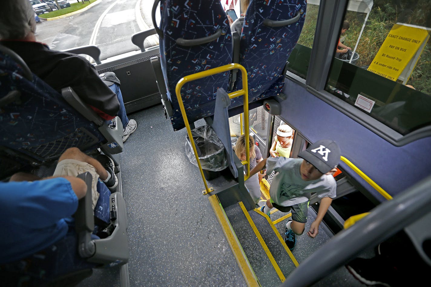 Passengers en route to the State Fair made their way onto a Southwest Transit double decker bus, Friday, August 29, 2014 in Eden Prairie, MN. The company is running the first double decker buses in the Twin Cities. They've wanted them for awhile but couldn't get because none were made in the US. ] (ELIZABETH FLORES/STAR TRIBUNE) ELIZABETH FLORES &#x2022; eflores@startribune.com