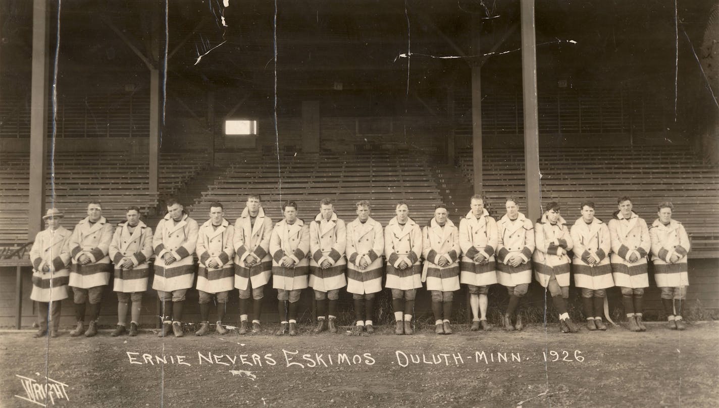 Duluth Eskimos, National Football League professional team, 1926. Posing in mackinaw jackets, team left to right: Ole Haugsrud(owner), Walt "Chet" Gayer, Dewey Scanlon, Walt Kiesling, Russ Method, "Jock" Murray, "Porky" Rundquist, Joe Rooney, Ernie Nevers, Art Johnson, Jack Underwood, "Cobb" Rooney, Bill Stein, Johnny "Blood" McNally, James Manion, "Oke" Carlson, and Paul Fitzgibbon. (Not shown: Charles "Doc" Kelly, "Red" Sullivan, "Doc" Williams, "Red" Quam, Jimmy Manion, and Wally Gilbert).