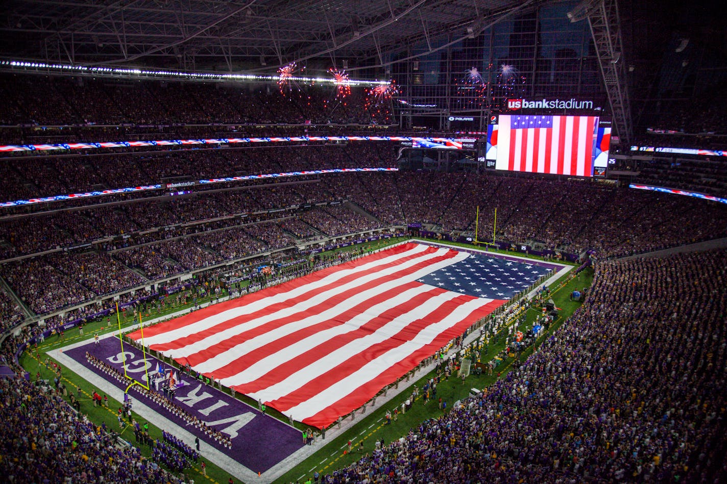 A giant American flag was unfurled before the Vikings played the Packers in 2016 at U.S. Bank Stadium.