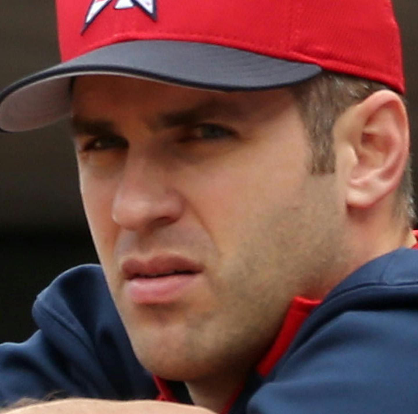 Minnesota Twins' Chris Colabello, left, and Joe Mauer watch from the dugout in the ninth inning as they lost 6-5 to the New York Yankees in a baseball game on Friday, July 4, 2014, in Minneapolis. (AP Photo/Jim Mone)