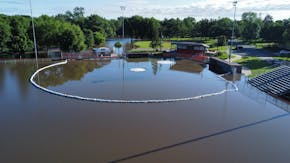 Memorial Ballpark in Dundas, Minn., on Sunday, June 23, 2024, as sandbagging around the infield could not keep the rising water from the Cannon River 