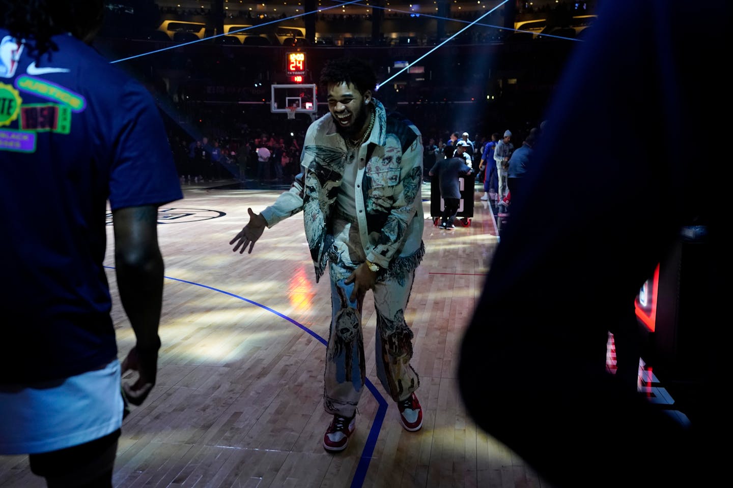 Minnesota Timberwolves center Karl-Anthony Towns smiles on the court before NBA basketball game against the Los Angeles Clippers Tuesday, Feb. 28, 2023, in Los Angeles. (AP Photo/Marcio Jose Sanchez)