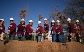 School staff and supporters take part in a groundbreaking event to celebrate the start of construction on the new Math and Science Academy campus in W