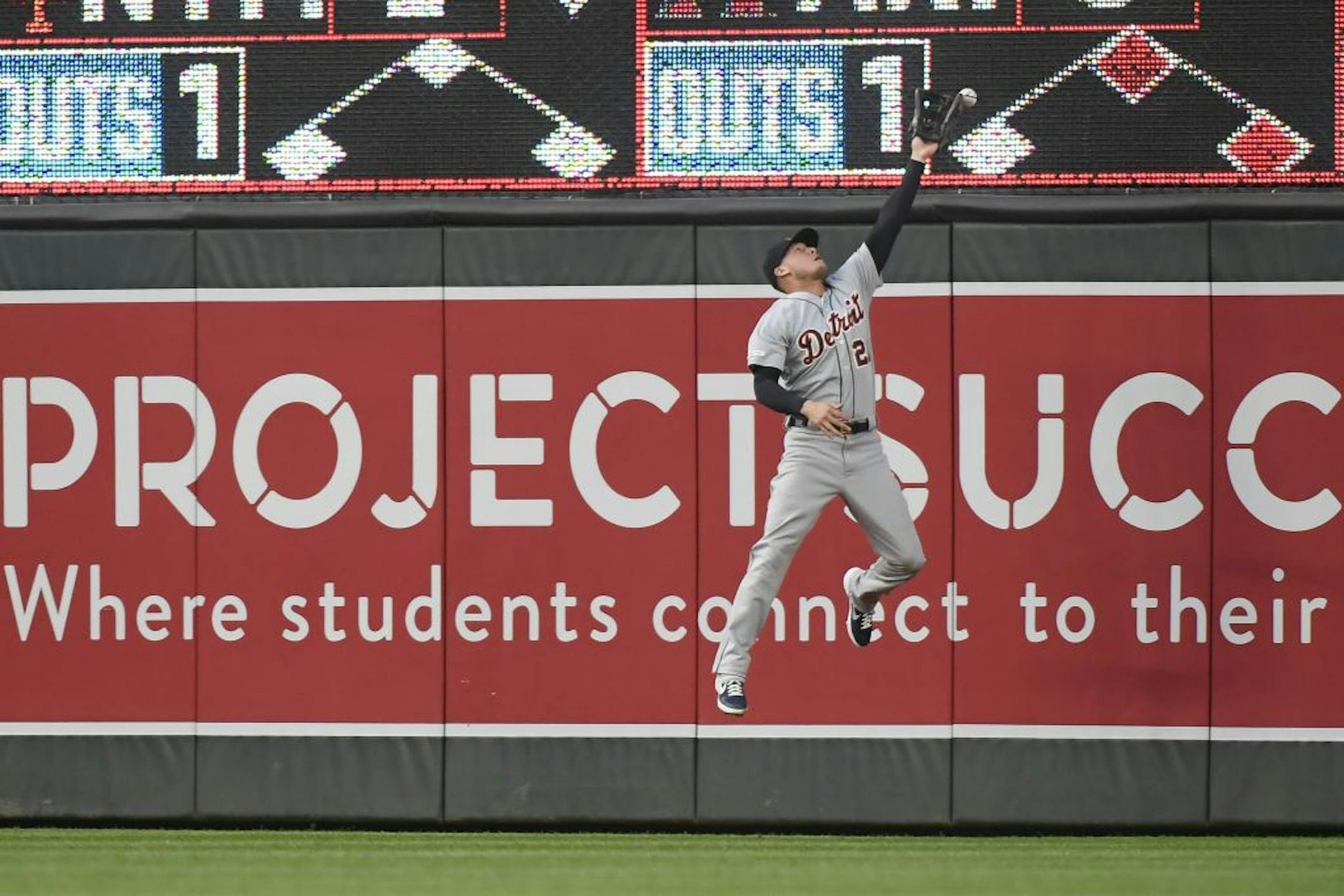 Detroit Tigers center fielder JaCoby Jones (21) was unable to catch a hit by Minnesota Twins catcher Mitch Garver (18) leading to a triple and a run scored by the Twins' Byron Buxton.