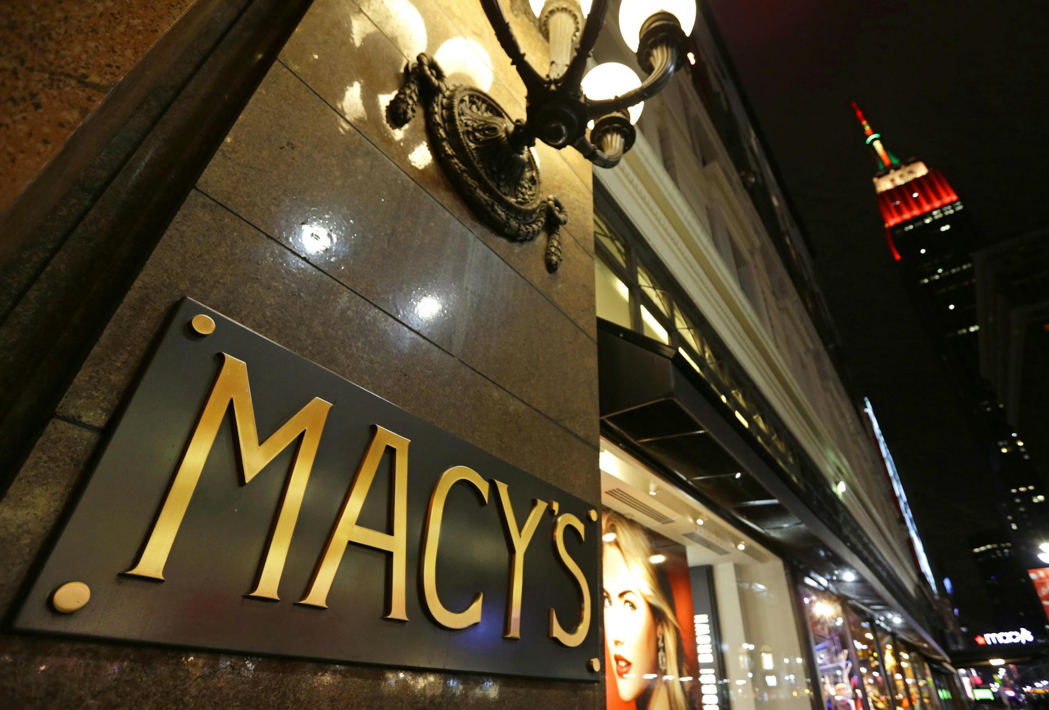 Macy's Inc. signage is displayed outside the company's store ahead of Black Friday in New York, U.S., on Thursday, Nov. 27, 2014. An estimated 140 million U.S. shoppers will hit stores and the Web this weekend in search of post-Thanksgiving discounts, kicking off what retailers predict will be the best holiday season in three years. Photographer: Peter Foley/Bloomberg ORG XMIT: 525581071