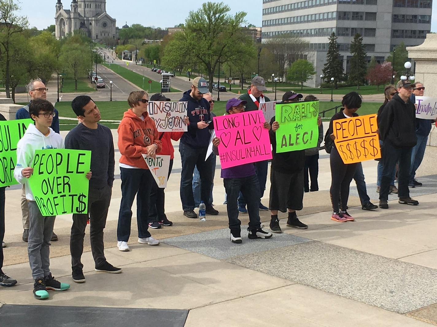 Amid chants of "Patients over profits," about 60 people attended a rally on the steps on the Minnesota state Capitol on Saturday calling for legislation aimed at reining in the pharmaceutical industry.