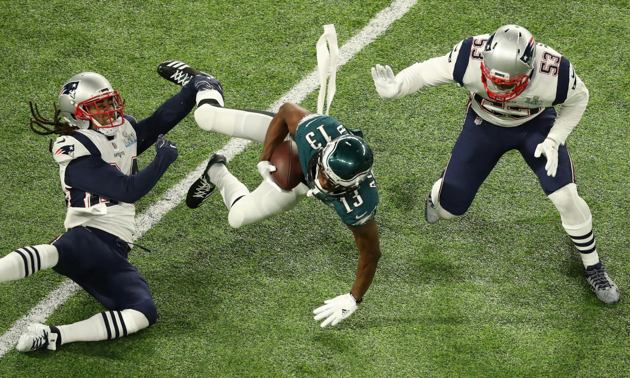 Philadelphia Eagles wide receiver Nelson Agholor (13) fell forward during the Eagles' first drive as Stephon Gilmore, left, and Kyle Van Noy defended in Super Bowl LII. ] ELIZABETH FLORES ï liz.flores@startribune.com The New England Patriots met the Philadelphia Eagles in Super Bowl LII Sunday evening, February 4, 2017 at U.S. Bank Stadium in Minneapolis.