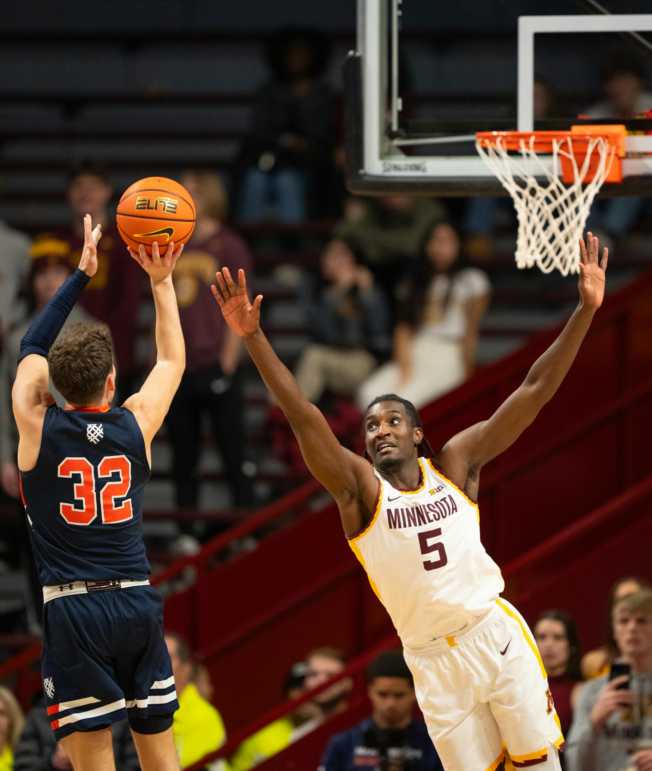 Macalester Scots guard Caleb Williams (32) shot over Minnesota Gophers forward Isaiah Ihnen (5) in the second half. Williams led all scorers with 41 points.