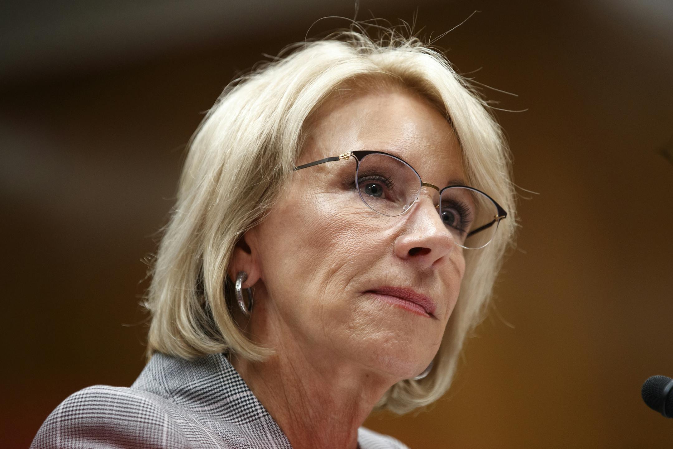 FILE -- Education Secretary Betsy DeVos testifies on Capitol Hill in Washington, June 5, 2018. The Trump administration will encourage the nation’s school superintendents and college presidents to adopt race-blind admissions standards, abandoning an Obama administration policy that called on universities to consider race as a factor in diversifying campuses. (Tom Brenner/The New York Times)