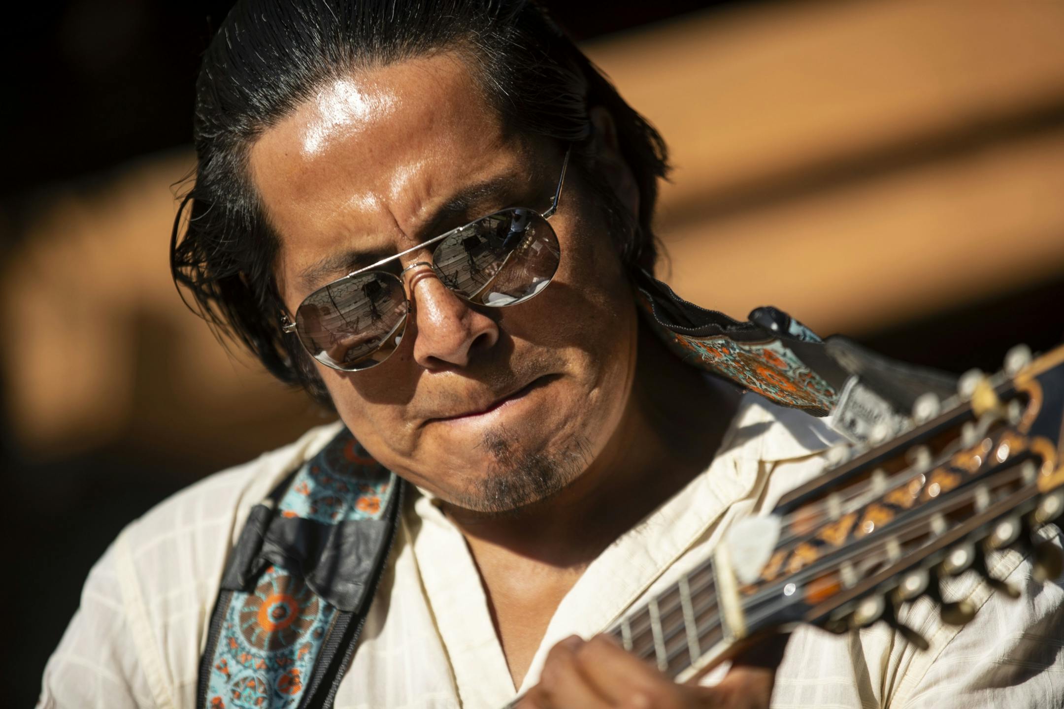 (From Left) Enrique Burga played the charangowith his band, Ecuador Manta. The group travels each year to Minnesota to perform at the state fair. On Friday August 23, 2019, they performed outside the DNR Building.
