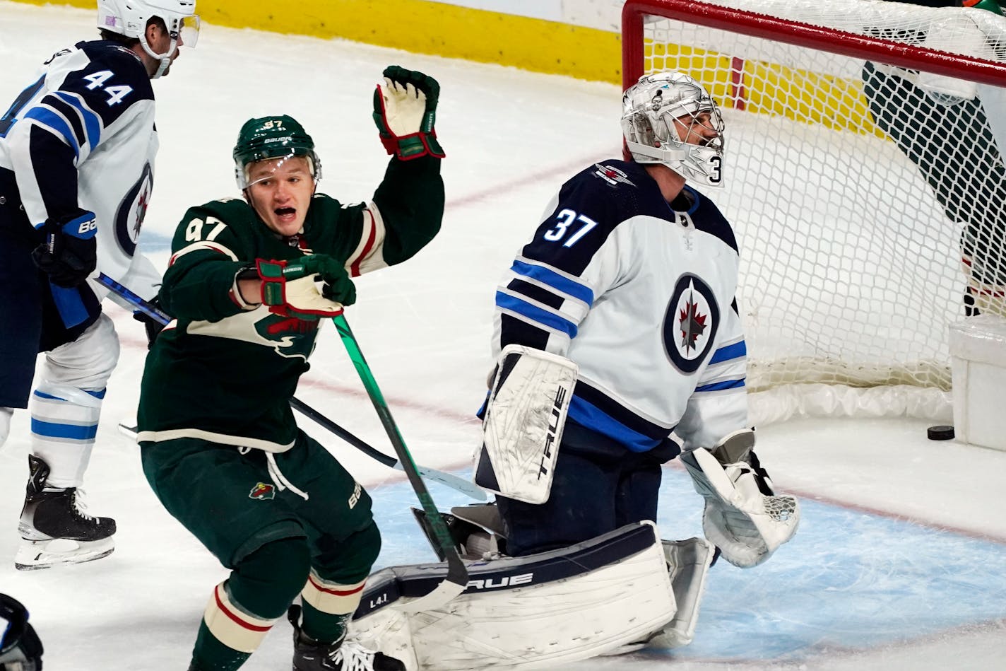 The Wild's Kirill Kaprizov celebrates his goal against Jets goalie Connor Hellebuyck in the first period Friday.