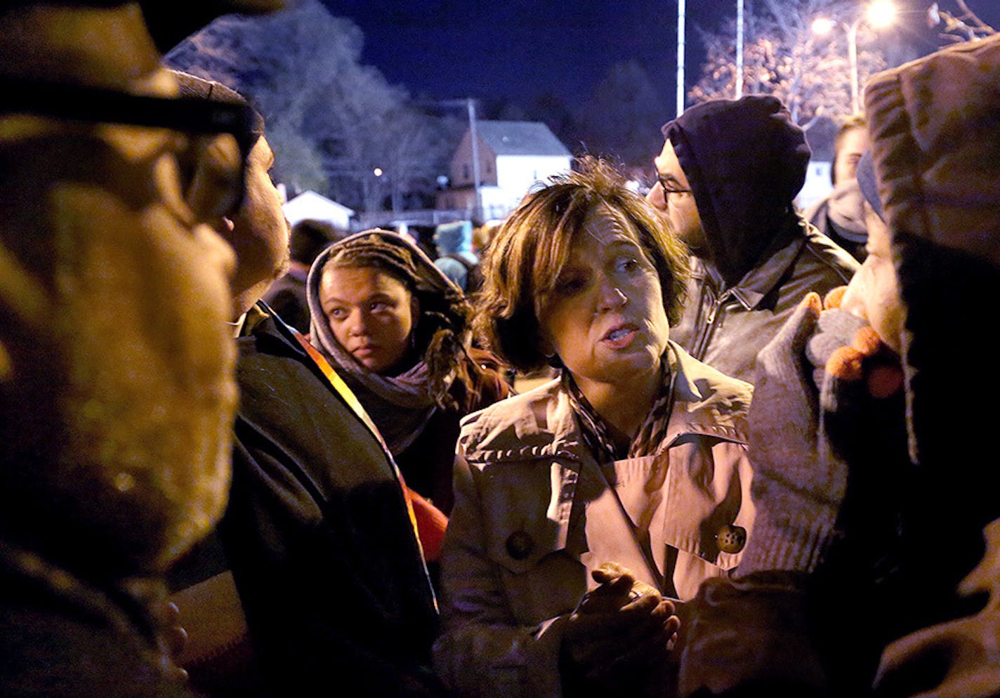 Protesters outside the Fourth Precinct station on Thursday night peppered Minneapolis Mayor Betsy Hodges with questions about police violence.