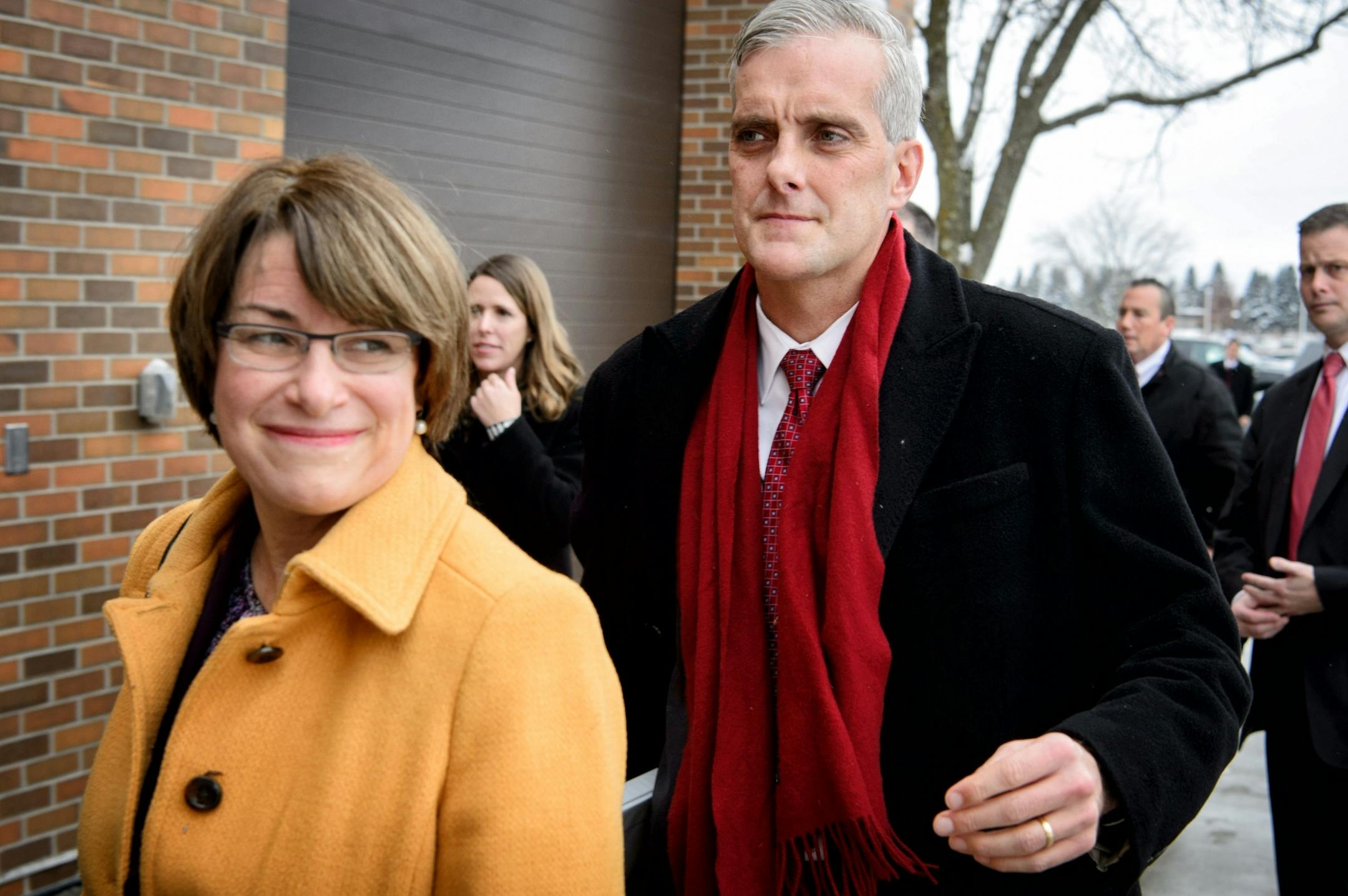 White House chief of staff Denis McDonough and Senator Amy Kobuchar enter the meeting.