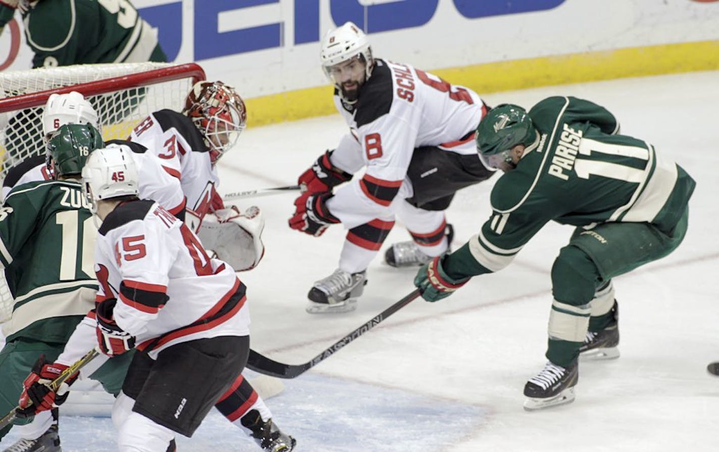 Wild left winger Zach Parise (11) scored against Devils goalie Cory Schneider