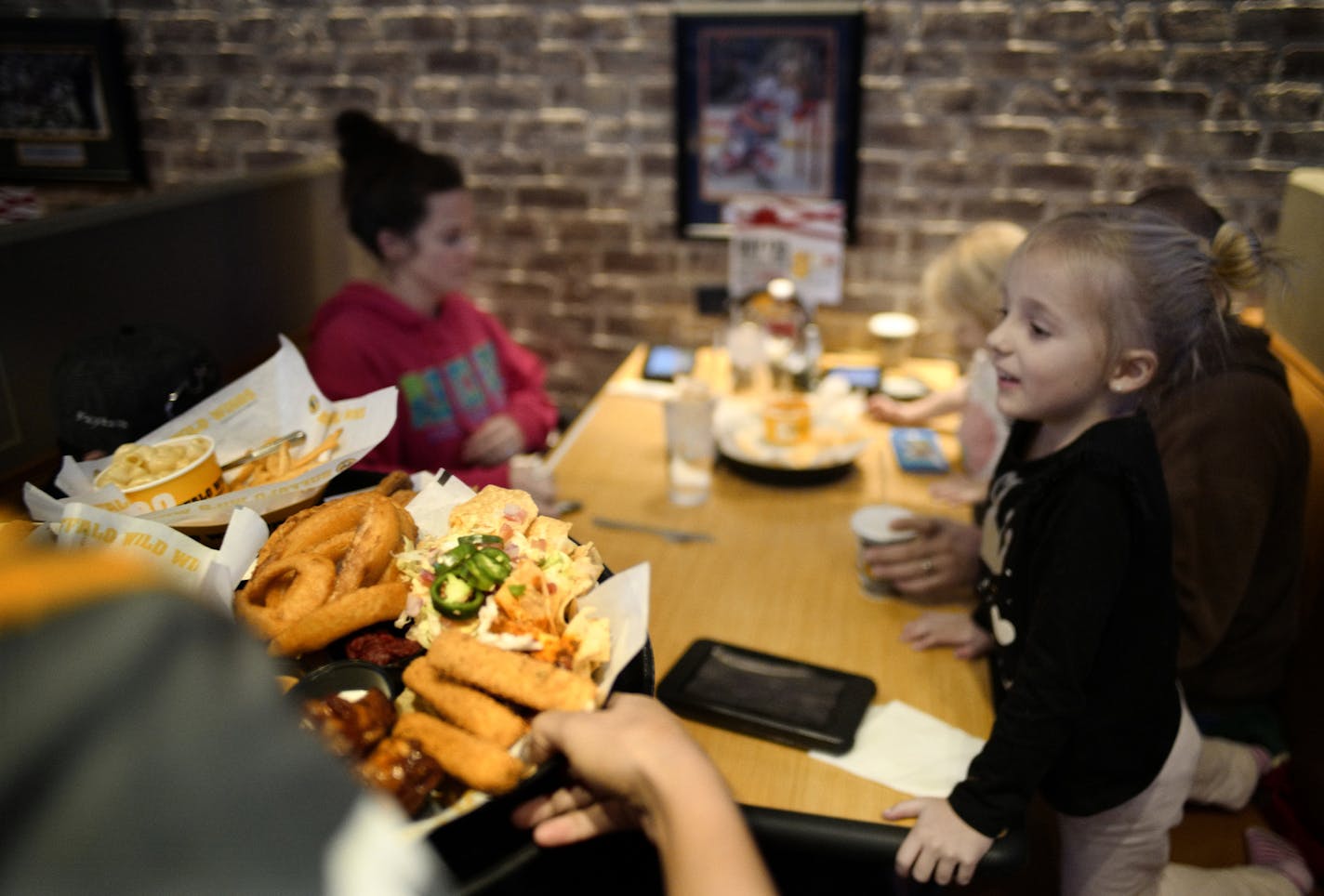 The Kugler family comes to the The Southdale location of Buffalo Wild Wings two to three times a month. On the far right is Hannah,5..] Arby's is taking over Buffalo Wild Wings. Richard Tsong-Taatarii/rtsong-taatarii@startribune.com