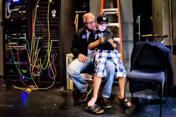 Gus Walz, 9, played Clash of Clans on his iPad while sitting on his dad's knee. Congressman Tim Walz took the stage a few minutes later.