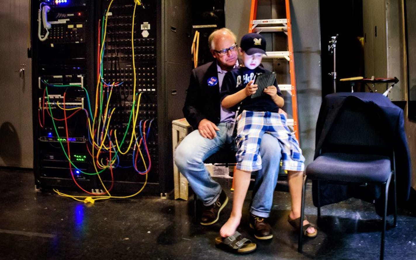 Gus Walz, 9, played Clash of Clans on his iPad while sitting on his dad's knee. Congressman Tim Walz took the stage a few minutes later.