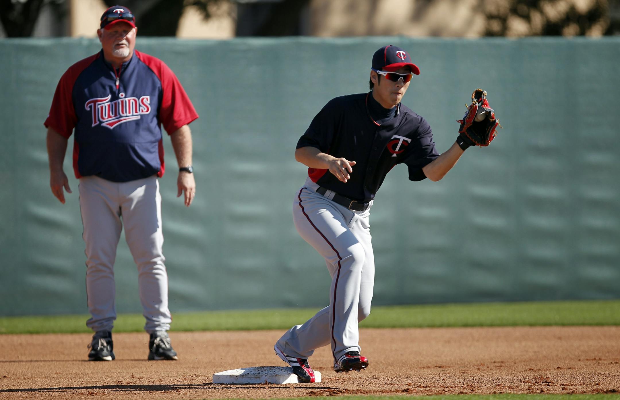 Twins manager Ron Gardenhire watched infielder Tsuyoshi Nishioka take infield during the "Good Morning America" drill.