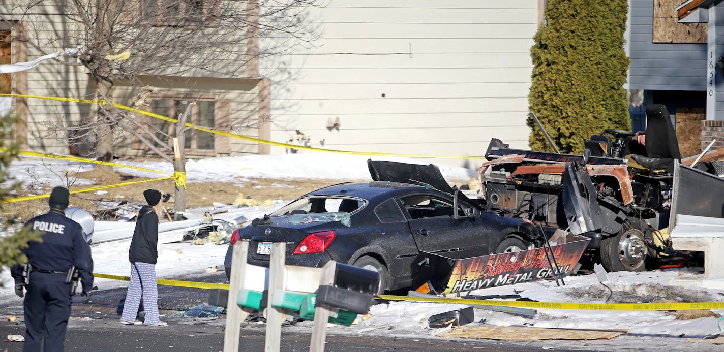 The aftermath of a food truck explosion in Lakeville that happened late Friday night and was seen in the 16500 block of Joplin Path Saturday, March 7, 2015, in Lakeville, MN](DAVID JOLES/STARTRIBUNE)djoles@startribune.com Police responded to the scene on the 16500 block of Joplin Path around 11:30 p.m. after a loud boom erupted on the block. Photos posted on social media by neighbors show scraps of metal strewn across yards and driveway and some damage to nearby homes.