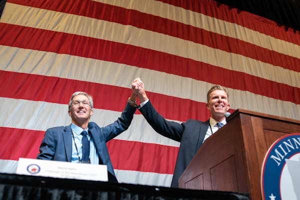 GOP candidate for governor Scott Jensen toot the stage with running mate Matt Birk. They were in second place after the fifth ballot, Saturday, May 14