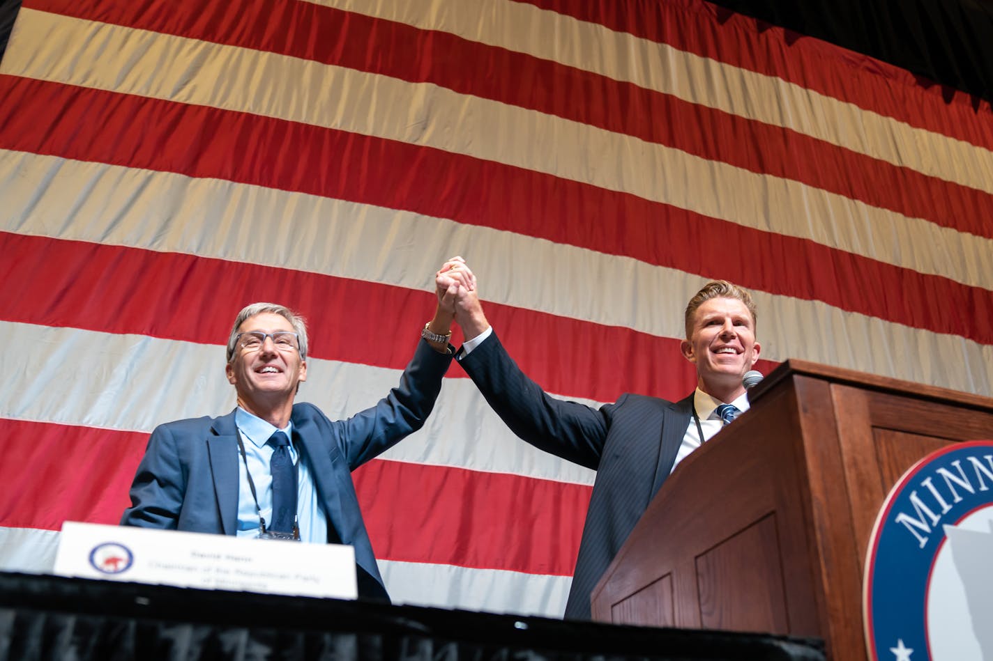 GOP candidate for governor Scott Jensen toot the stage with running mate Matt Birk. They were in second place after the fifth ballot, Saturday, May 14, 2022 Rochester, Minn. The second day of the Minnesota Republicans state convention which will endorse a candidate from the crowded field running for governor at the party's statewide convention to take on DFL Gov. Tim Walz this fall. ] GLEN STUBBE • glen.stubbe@startribune.com