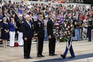 Vice President Mike Pence, from left, U.S. Army Maj. Gen. Michael Howard and acting Defense Secretary Patrick Shanahan participate in a wreath-laying 