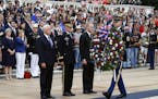Vice President Mike Pence, from left, U.S. Army Maj. Gen. Michael Howard and acting Defense Secretary Patrick Shanahan participate in a wreath-laying 