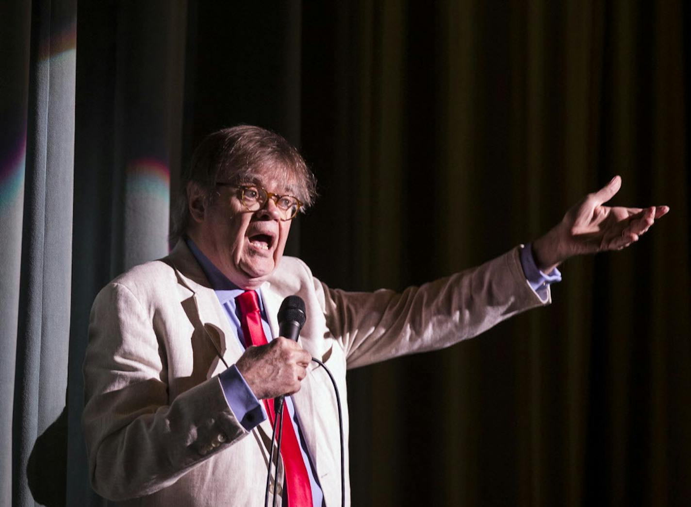 Garrison Keillor greets the audience, asking them to stand and sing "The Star Spangled Banner." ] (Leila Navidi/Star Tribune) leila.navidi@startribune.com BACKGROUND INFORMATION: The live broadcast for "A Prairie Home Companion" at the State Theatre in Minneapolis on Saturday, May 21, 2016. This is Garrison Keillor's last season on "A Prairie Home Companion." ORG XMIT: MIN1605231558460785