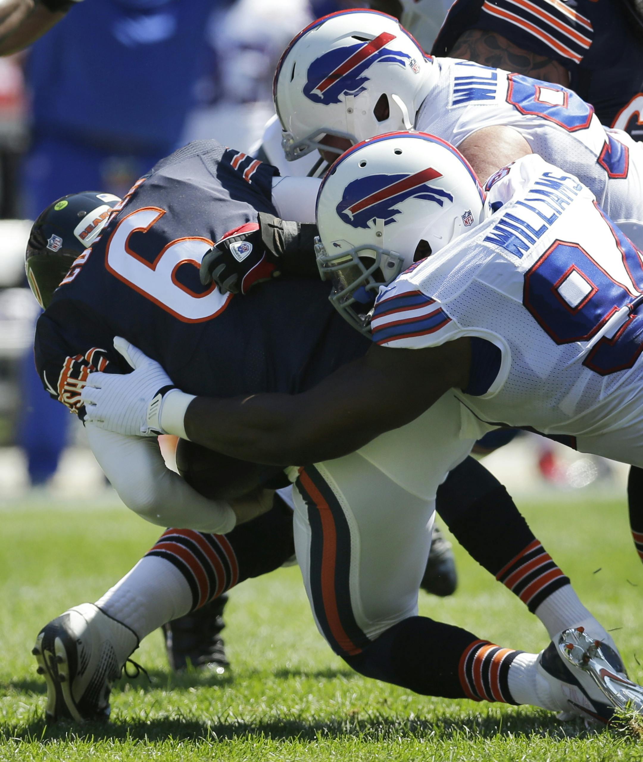 Chicago Bears quarterback Jay Cutler (6) is sacked by Buffalo Bills defensive end Mario Williams (94) and defensive tackle Kyle Williams and during the first half of an NFL football game Sunday, Sept. 7, 2014, in Chicago. (AP Photo/Nam Y. Huh)