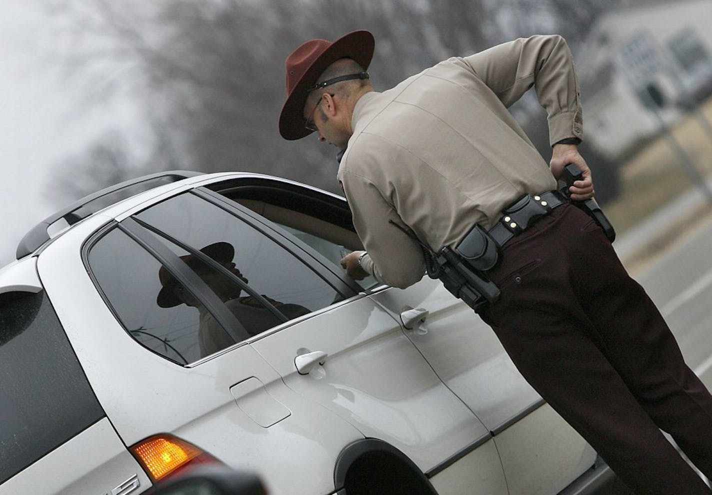 Minnesota State Patrol Sgt. Curt Thurmes talked to a driver after making a traffic stop for speeding in 2009. Nationwide, the average insurance rate goes up 14 percent after a speeding ticket and 62 percent following a DWI arrest.