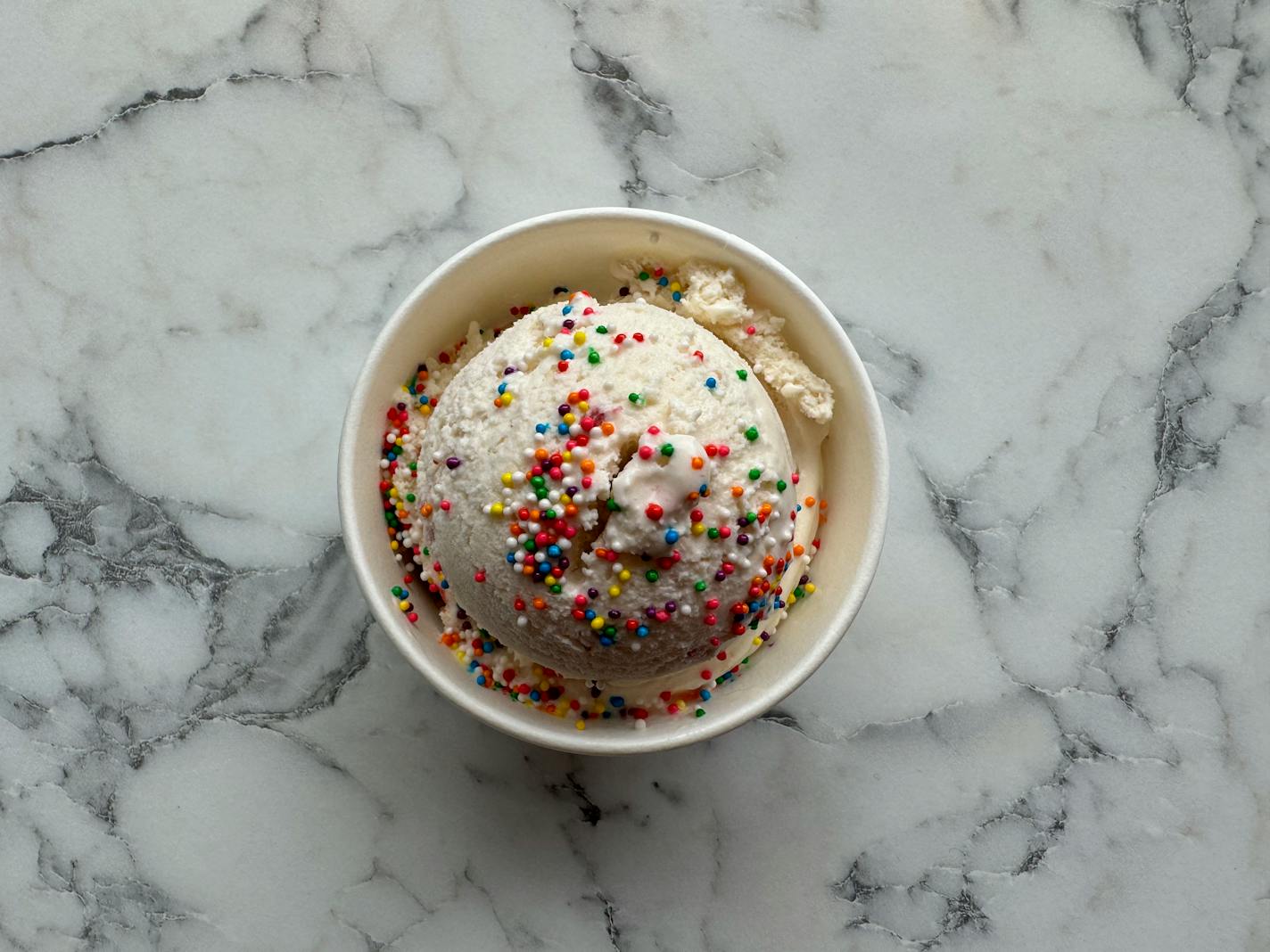 The raspberry honey ice cream with optional rainbow sprinkles from Sugar & Salt in Minneapolis.