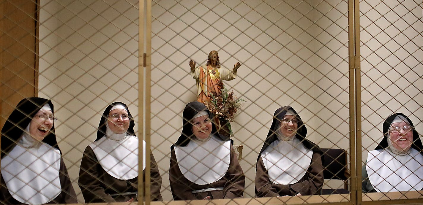 "It's not hopeless": Mother Marie Immaculata, from left, Sister Mary Christiana, Sister Mary Matthew, Sister Marie Elizabeth, Mother Mary Barbara and the other nuns at Saint Clare's Monastery in Sauk Rapids, Minn., said they are praying for everyone during the COVID-19 pandemic.