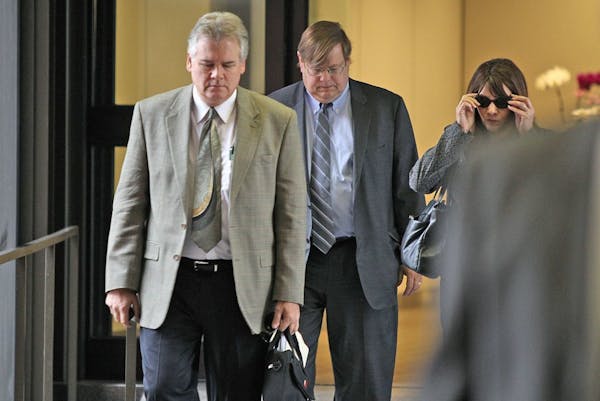 In this file photo, Frank Vennes, left, made his way out of the Federal Courthouse in St. Paul on Wednesday, June 5, 2013.