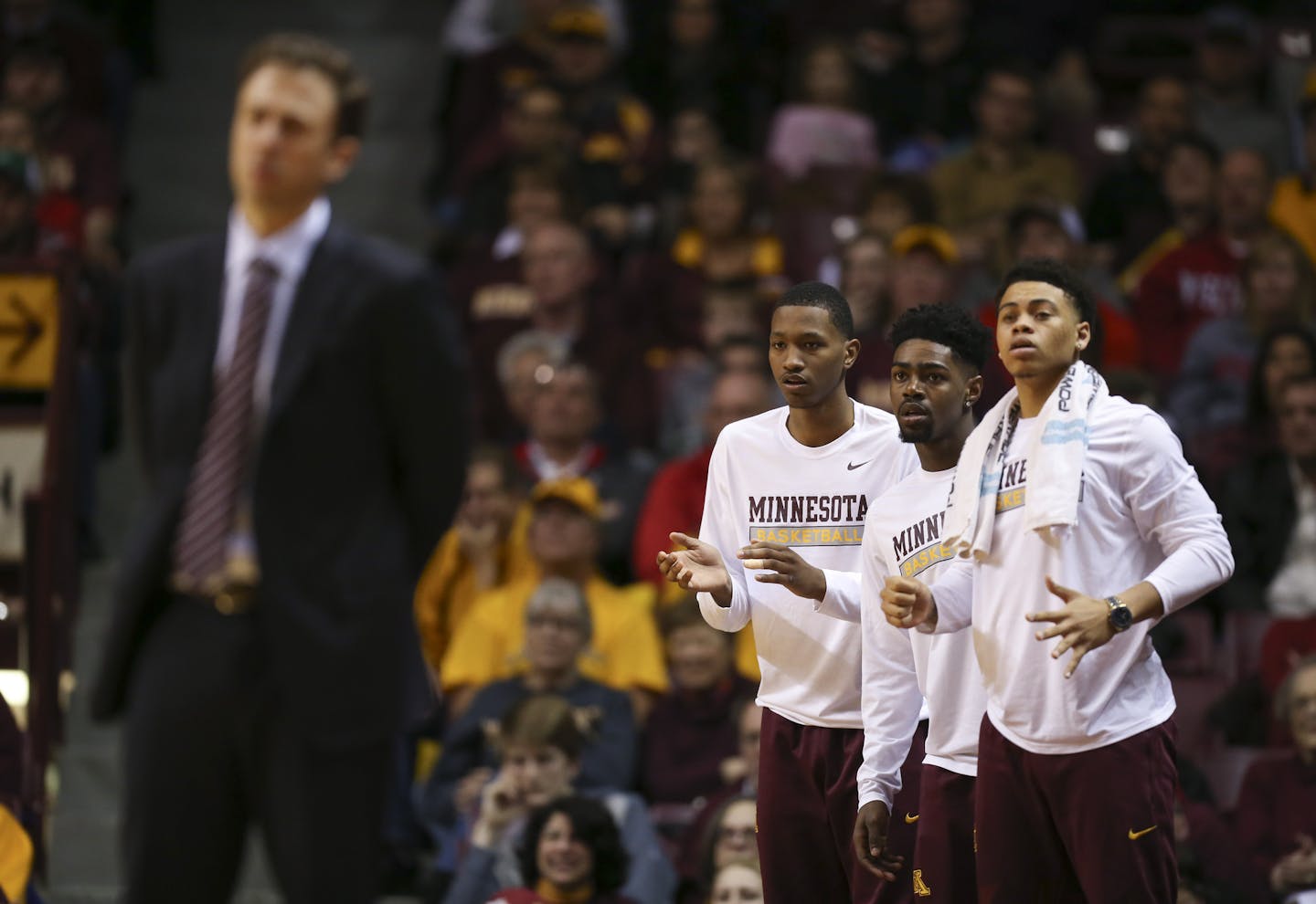 Suspended Gophers guards Dupree McBrayer, Kevin Dorsey and Nate Mason stood on the edge of the court as their teammates made a surge in the second half against Wisconsin on March 2.