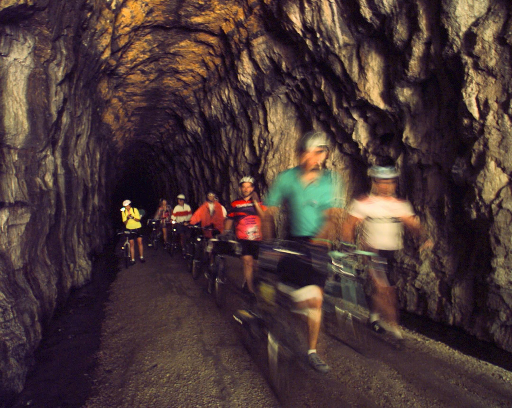 daaily-day three, sparta to reedsburg -- Riders at the end of a 3/4 mile-long walk through a tunnel along the route between the Sparta, WIS. to Elroy, WIS bicycle trail.