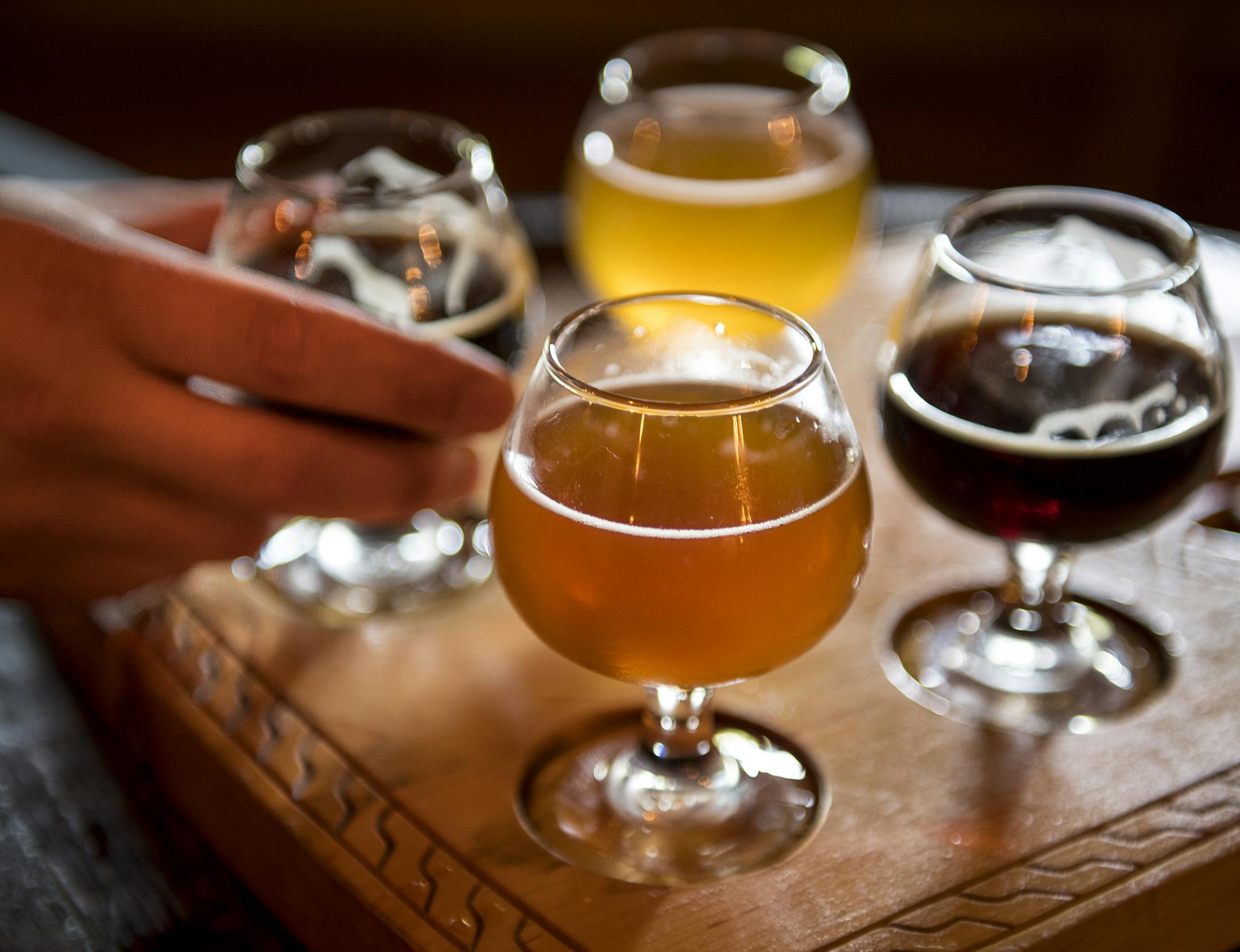 Chris Mikkelsen (CQ), of Mayer, grabbed a glass of Dunkelwald Saturday at Hammerheart Brewing's taproom. ] (AARON LAVINSKY/STAR TRIBUNE) aaron.lavinsky@startribune.com Photos to accompany a feature on craft beer taprooms. Photographed Saturday, June 25, 2016 in White Bear Lake and Lino Lakes.