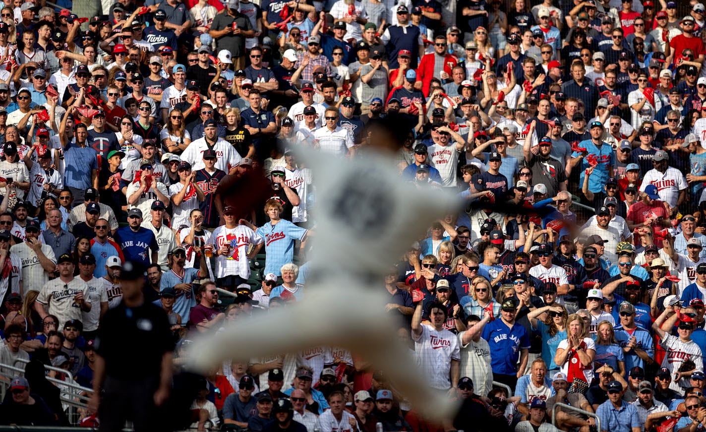 Fans cheer on Minnesota Twins pitcher Pablo Lopez while he throws to a batter with two strikes in the third inning during Game 1 of the Wild Card series, Tuesday, October 3, 2023, at Target Field in Minneapolis, Minn. ] CARLOS GONZALEZ • carlos.gonzalez@startribune.com