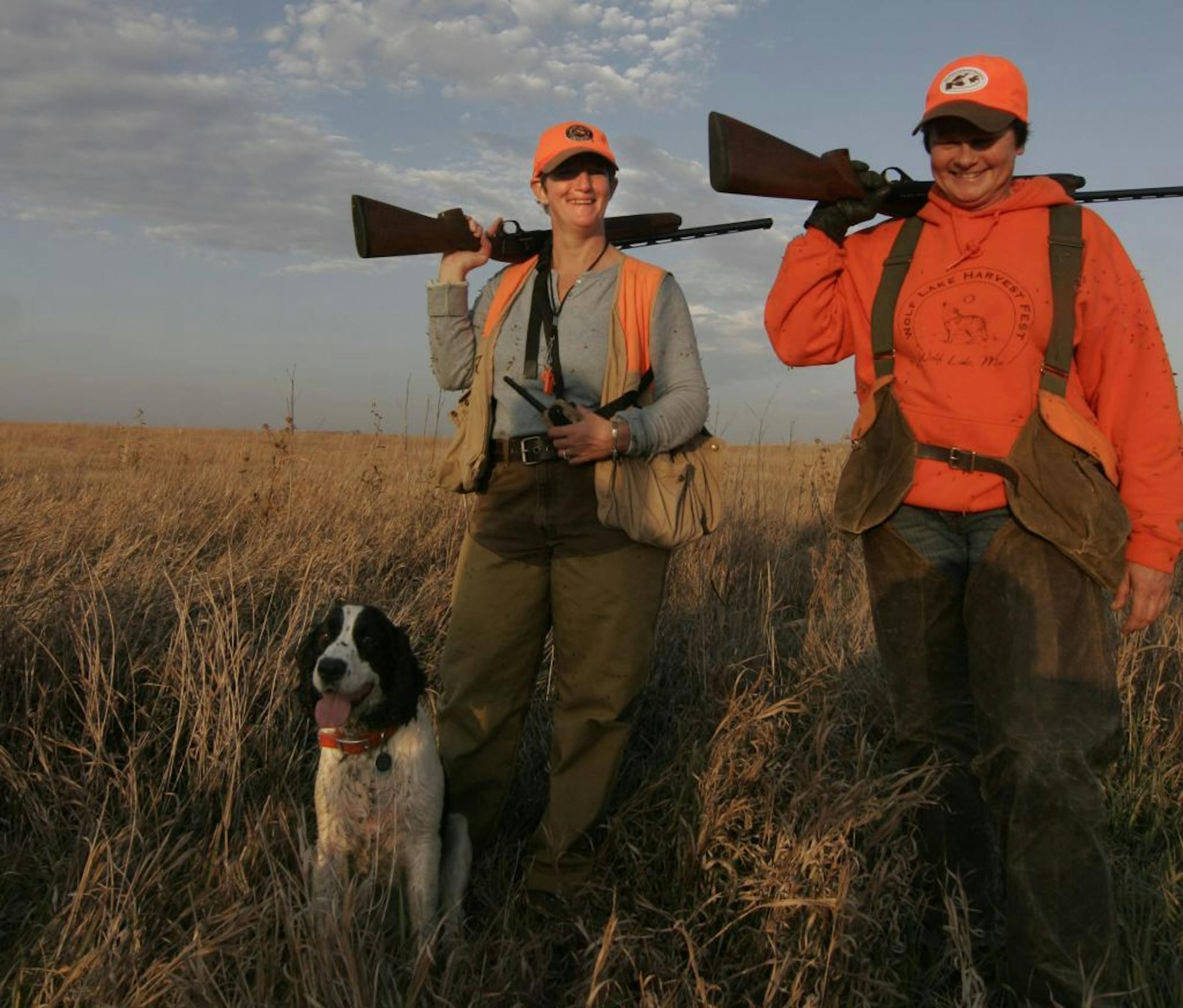 Patti Carr (left) and Lori Laine, both of Detroit Lakes, Minn., are upland hunting buddies. With them is Carr's English springer spaniel, Annie.