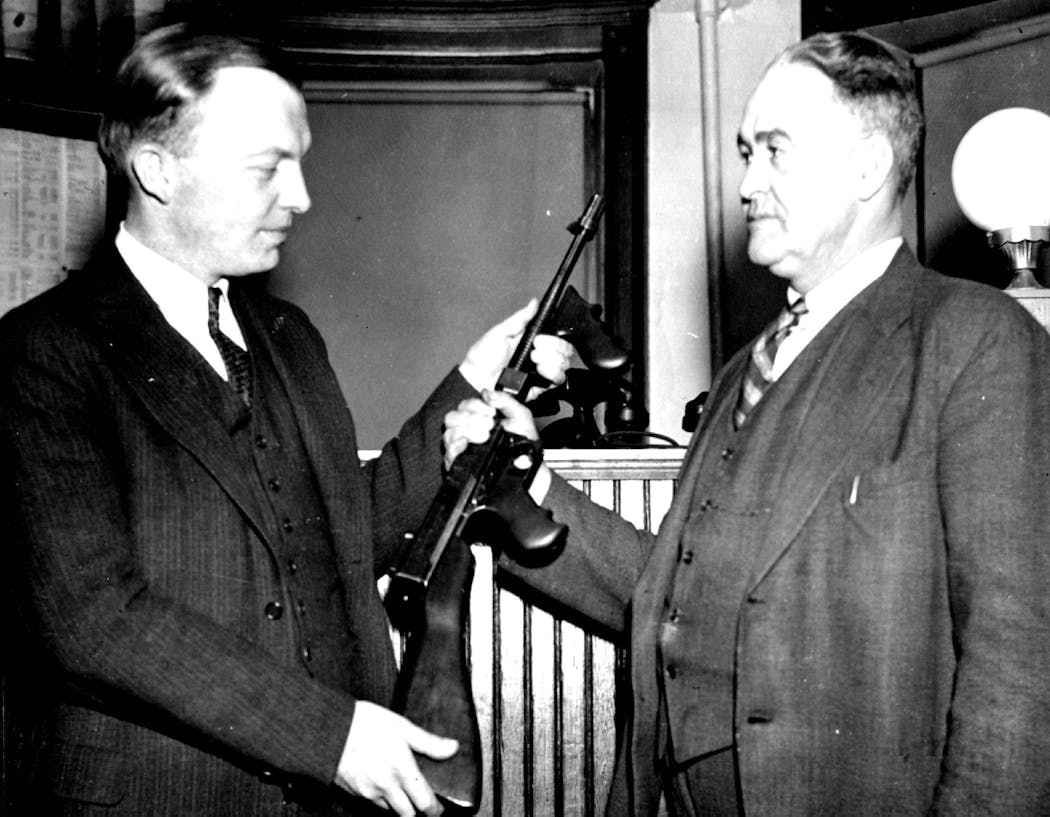 March 1935: Harold Stassen, then Dakota County attorney, handed South St. Paul Police Chief E.J. Mcalpine a machine gun identified as the one used in the killing of officer Leo Pavlak in a payroll holdup in September 1933. The gun, stolen from a South St. Paul police car, was found in the Chicago apartment of Arthur (Loc) Barker, alleged kidnapper of Edward G. Bremer, St. Paul banker.