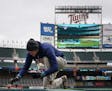 Grounds crew prepared Target Field for Game 3 of American League Division Series between the Twins and the Yankees.