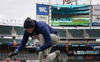Grounds crew prepared Target Field for Game 3 of American League Division Series between the Twins and the Yankees.