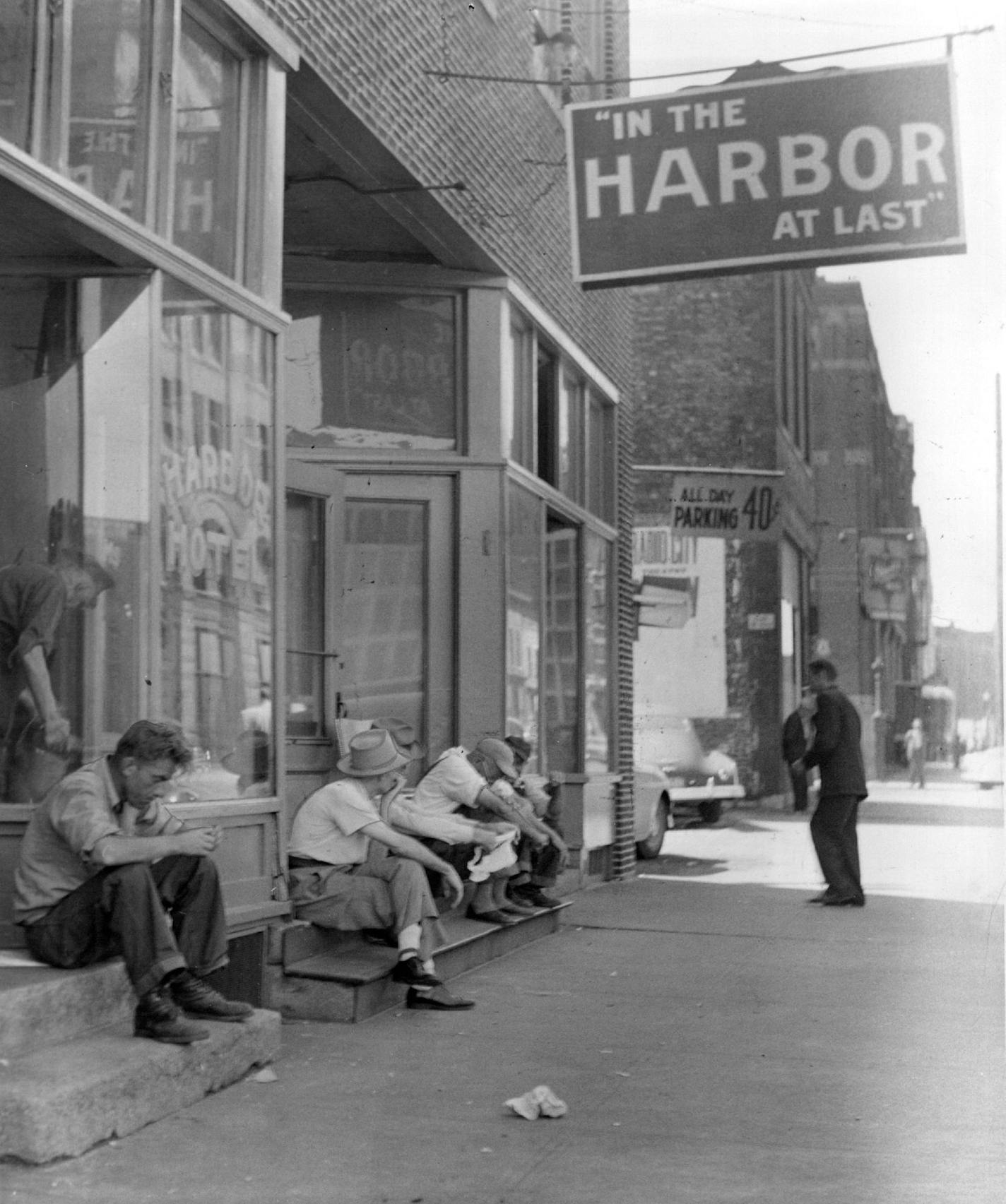 Hard-luck residents of the Gateway District hung out in 1953 outside the Harbor Hotel.