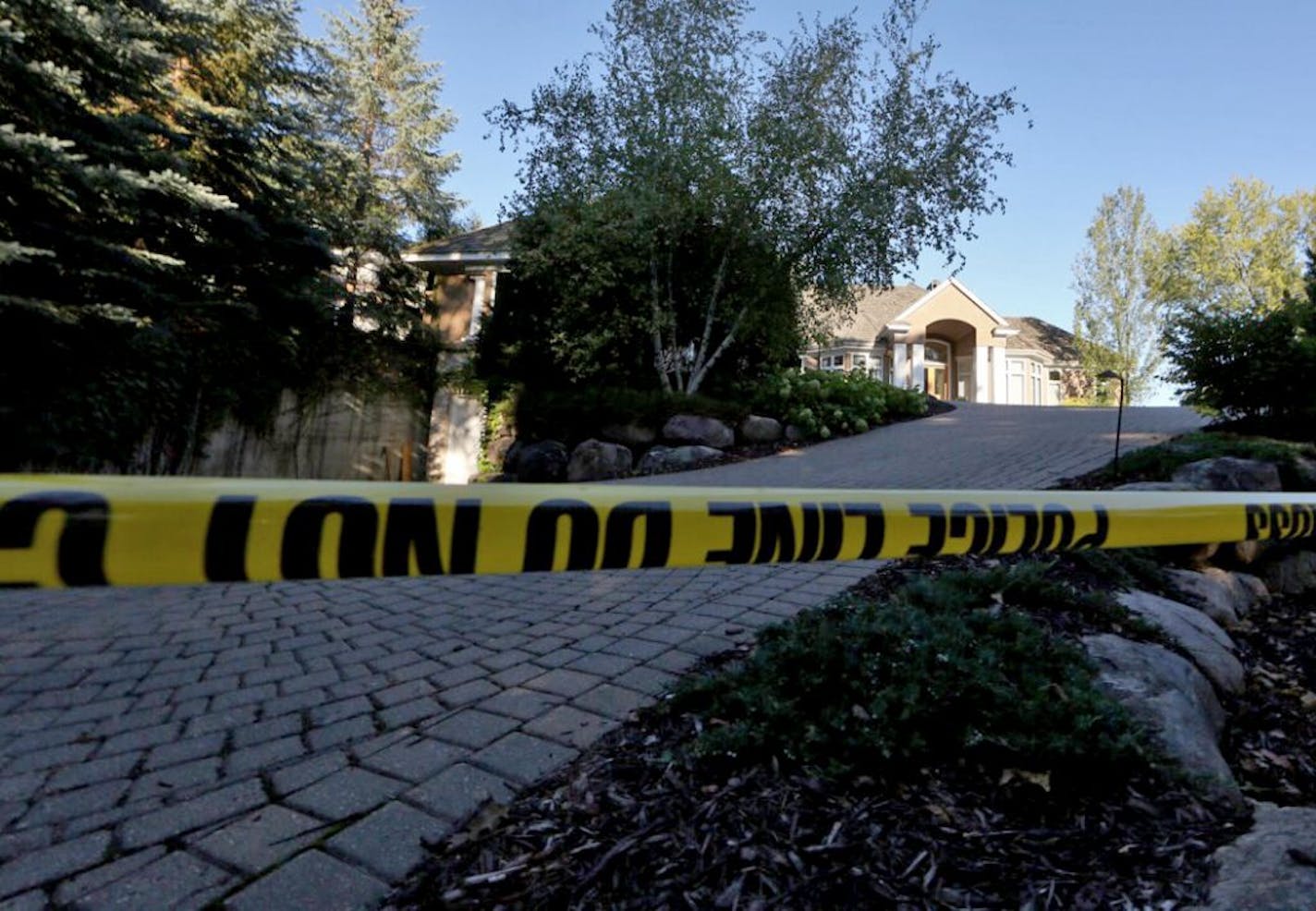 Yellow crime tape at the Greenwood, MN home of the Brian Short family, all five members discovered dead on Thursday, Sept. 10, 2015.,