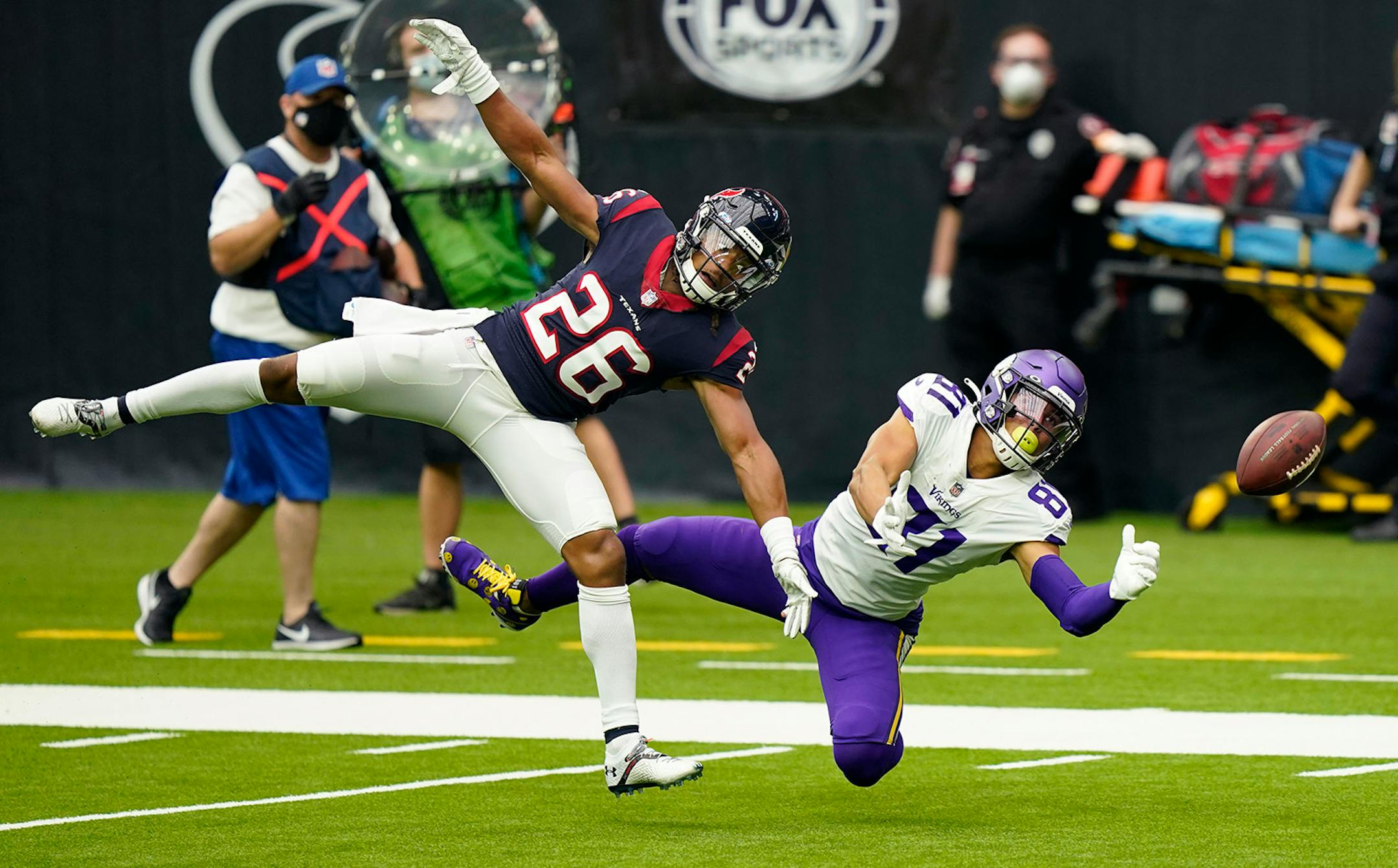 Houston Texans cornerback Vernon Hargreaves III (26) breaks up a pass intended for Minnesota Vikings wide receiver Bisi Johnson (81) during the first half of an NFL football game Sunday, Oct. 4, 2020, in Houston. (AP Photo/David J. Phillip)
