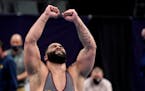 Minnesota's Gable Steveson celebrates after defeating Michigan's Mason Parris during their 285-pound match in the finals of the NCAA wrestling champio