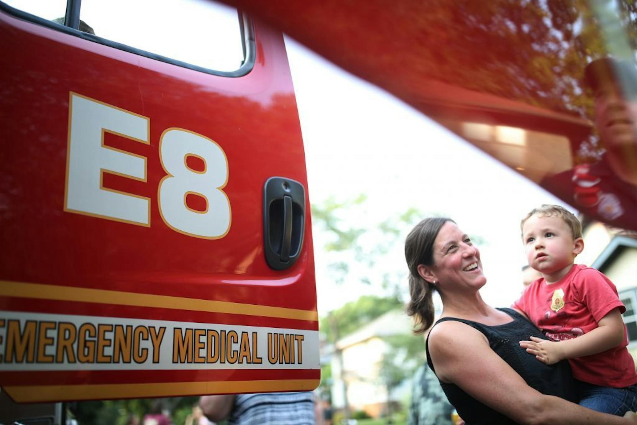 Christine Rohr and her son Jude Rohr 3, checked out a fire truck during National Night Out in the 4200 block of Harriet Avenue south August 1, 2017 inMinneapolis, MN.