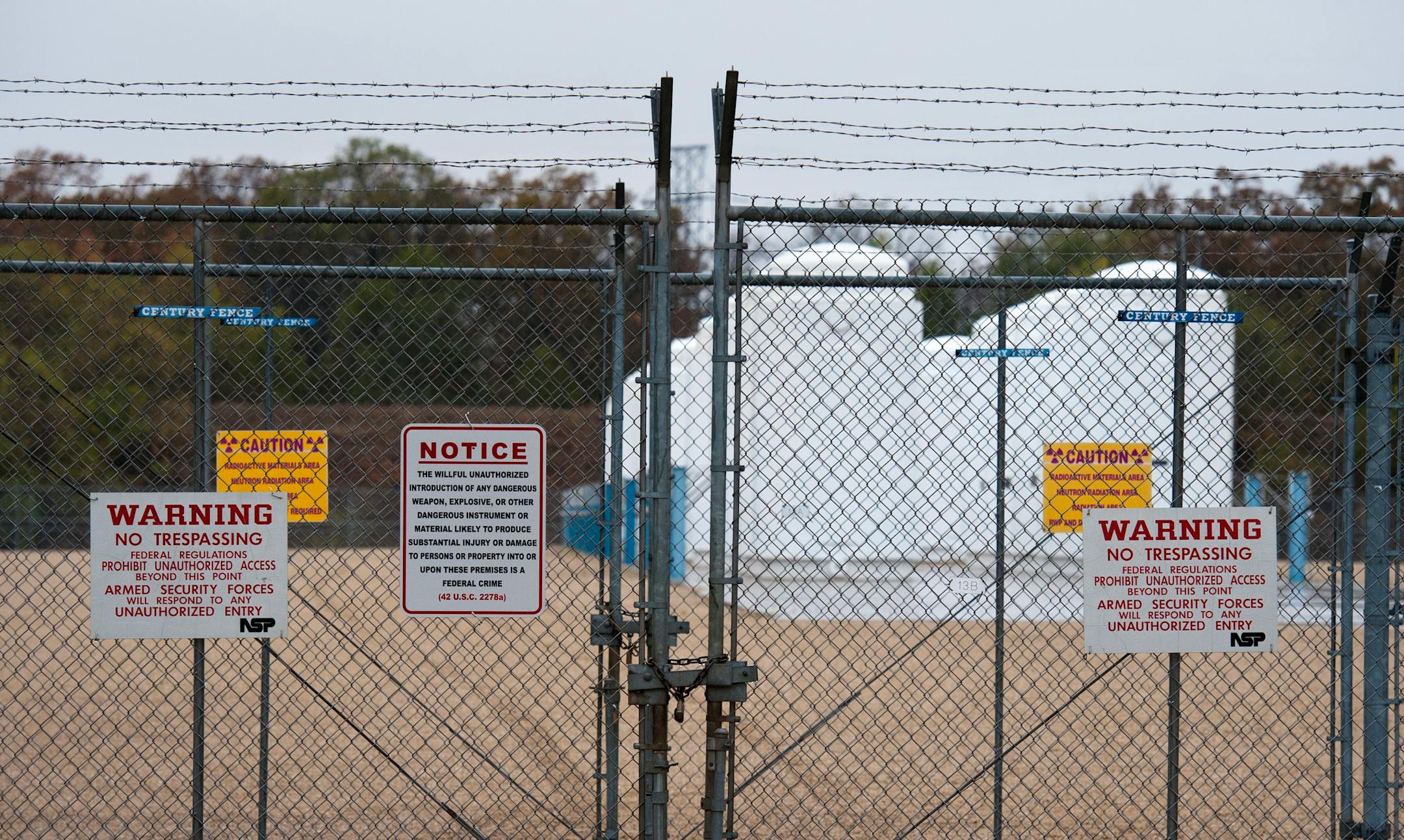 In this file photo from from Oct. 9, 2012, spent nuclear fuel rods are stored behind a double chain link fence in these casks. The Xcel Energy Prairie Island Nuclear Plant north of Red Wing is looking to boost electrical output at the plant.