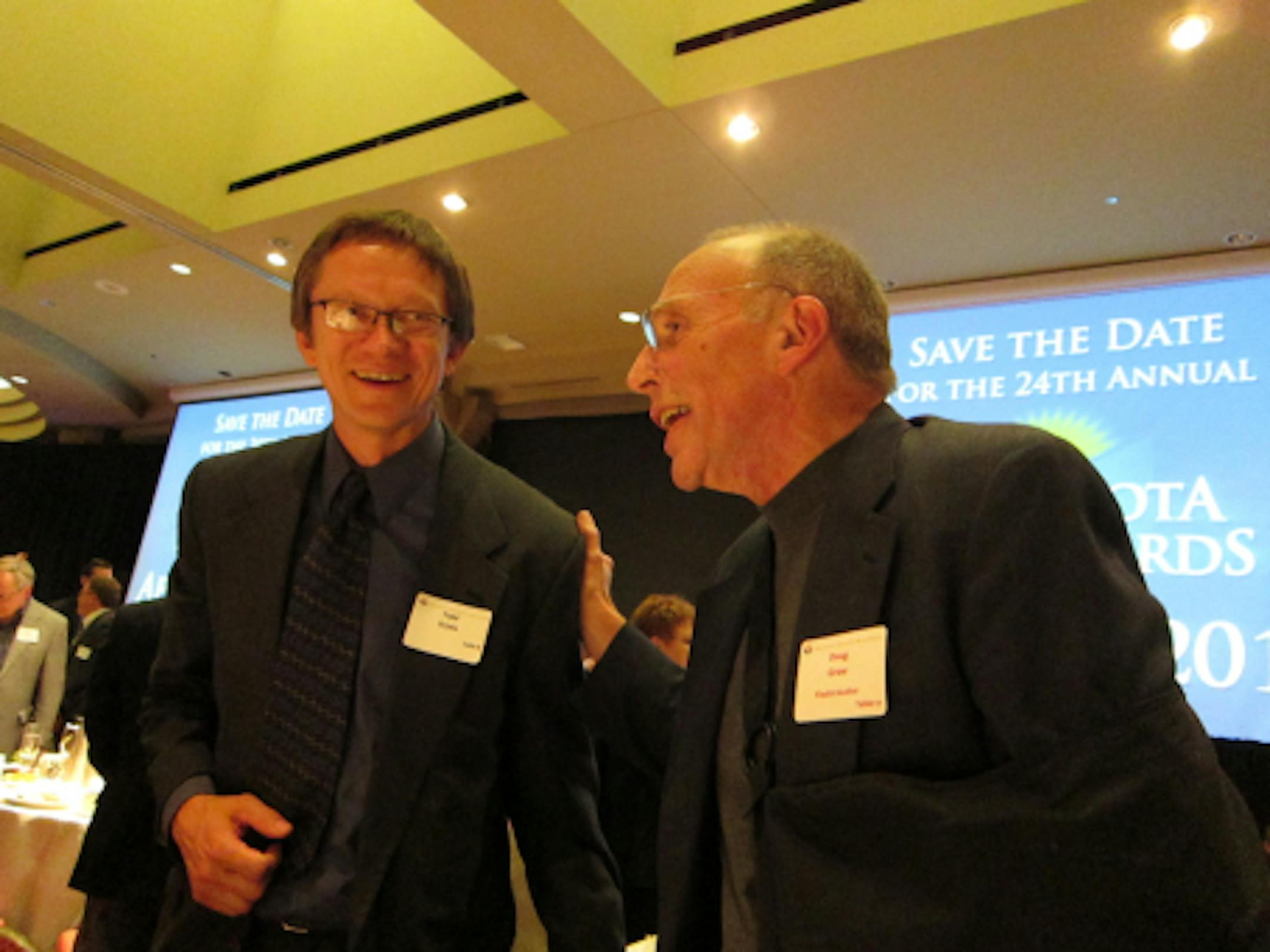 University of Minnesota Press senior acquisitions editor Todd Orjala had a great night; five of his books were in the running, and three won. Shown here with nominee Doug Grow.